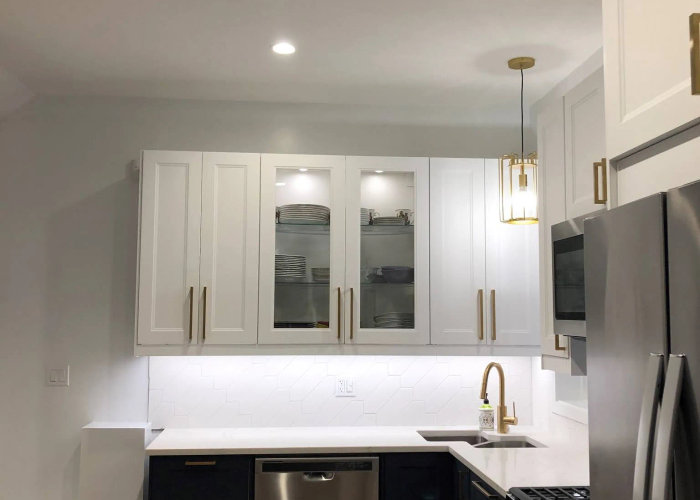 N Marshfield Ave West Town kitchen after -- white cabinets, MSI countertops, refinished hardwood