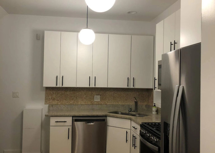 N Marshfield Ave West Town kitchen before -- dark cabinets and cramped layout