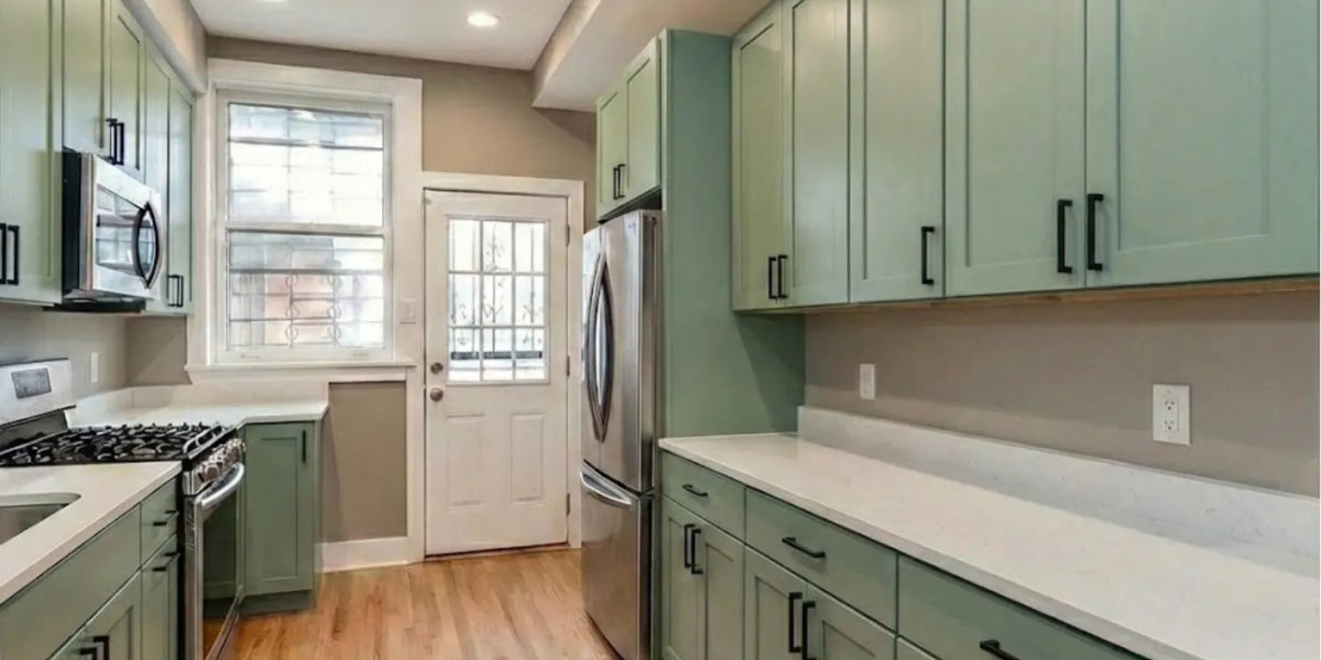 River North kitchen after remodel -- USA cabinets MSI quartz maple stained floors