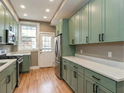 River North kitchen after remodel -- custom USA made cabinets MSI quartz countertops maple floor staining Chicago