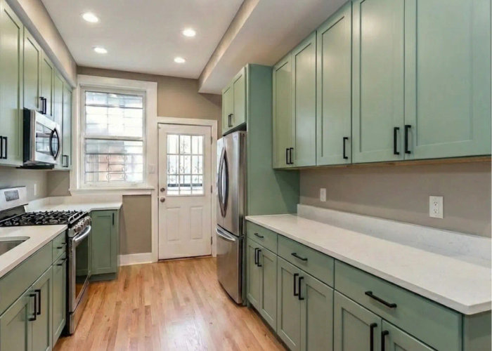 River North kitchen after remodel -- custom USA cabinets MSI quartz maple floor staining modern chic Chicago