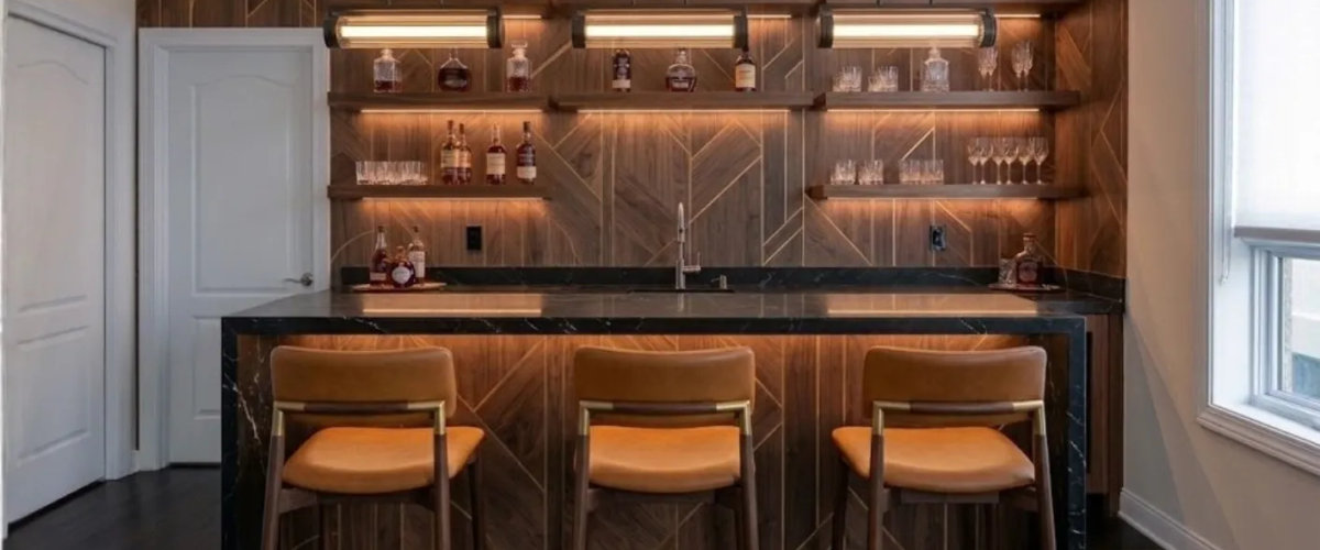 Custom wet bar design Chicago 2026 -- waterfall quartz, custom cabinetry by Assembly Squad