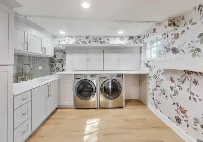 Winnetka basement remodel with custom gray cabinets, quartz countertops, and champagne bronze fixtures on Fairview Ave