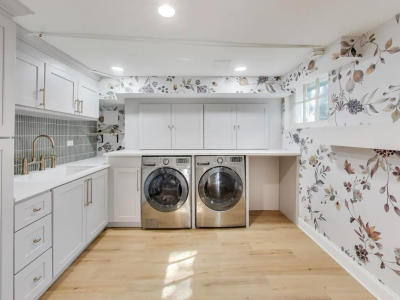 Winnetka finished basement after remodel -- luxury laundry room custom gray cabinets quartz countertops