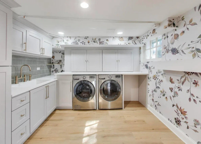 Winnetka finished basement after remodel -- custom gray cabinets, quartz countertops, champagne bronze fixtures