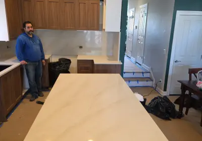 Logan Square affordable kitchen remodel on W Wellington Ave with custom cabinets, stone countertop and backsplash, and custom dry bar under $50K