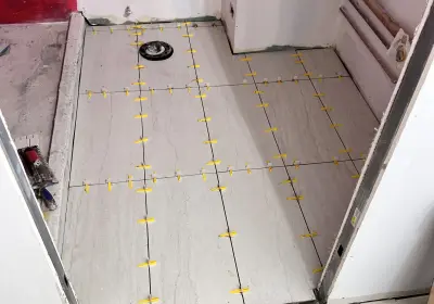 Gold Coast condo gut renovation at Newberry Plaza 1030 N State St with custom kitchen, MSI waterfall countertop, and 3 bathroom remodels