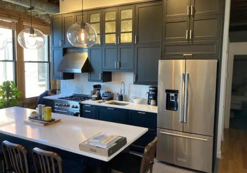 Modern finishes and layout West Loop loft black IKEA kitchen renovation Chicago