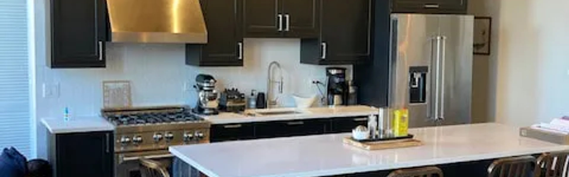West Loop loft black IKEA kitchen under 28k -- bold modern black cabinets budget renovation 2 weeks Chicago 2026