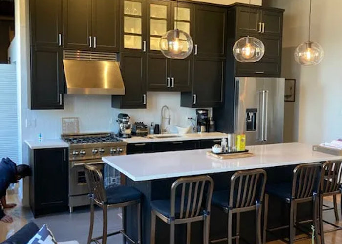 West Loop loft kitchen after black IKEA renovation -- bold modern under $28K 2 weeks Chicago