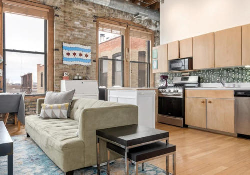 West Loop loft kitchen before renovation -- original dated cabinets condition