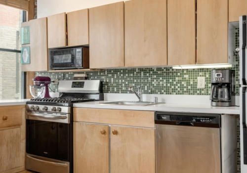 West Loop loft kitchen before view 3 -- original dated condition Chicago