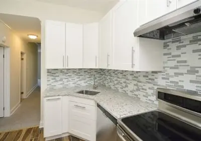 Strategic Boys Town condo 1-bedroom to 2-bedroom conversion with modern kitchen renovation to increase rental value