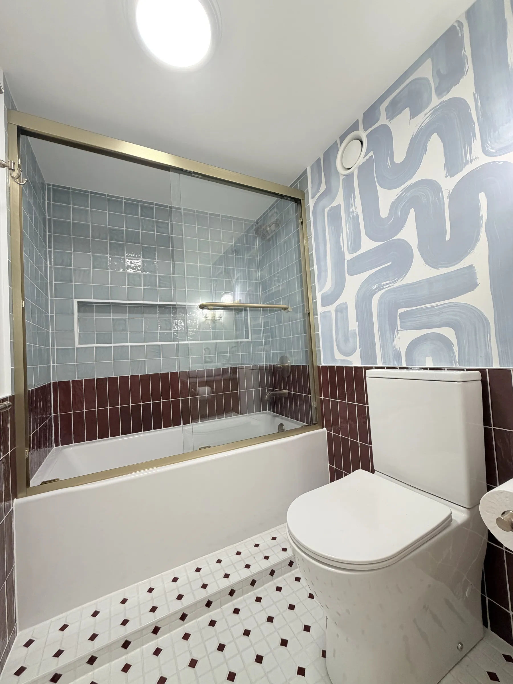 After -- Merola Oxford matte white hex mosaic floor with maroon dots and Bordeaux Zellige wainscot at 124 W Polk, Unit 707, The Lex, Printers Row, by Assembly Squad