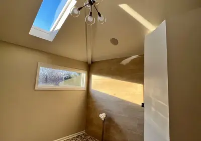 Spacious modern bathroom renovation in Bucktown with custom tile work, walk-in shower, and new fixtures