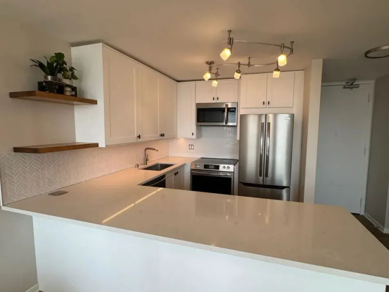 111 E Chestnut Streeterville kitchen after remodel -- open concept with custom cabinetry