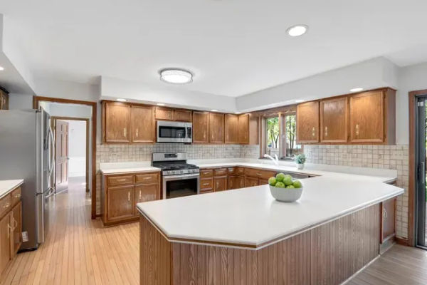 Wilmette kitchen before - dated cabinets and layout