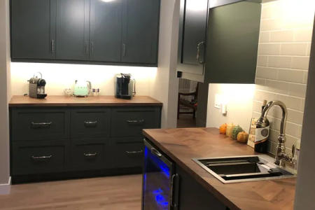 Lincoln Park luxury kitchen overview -- waterfall quartz island two-tone cabinets