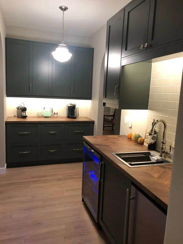 Lincoln Park kitchen with waterfall quartz island and two-tone cabinets