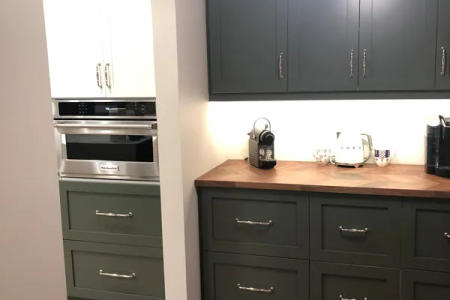 Pendant lighting over waterfall island Lincoln Park luxury kitchen Chicago