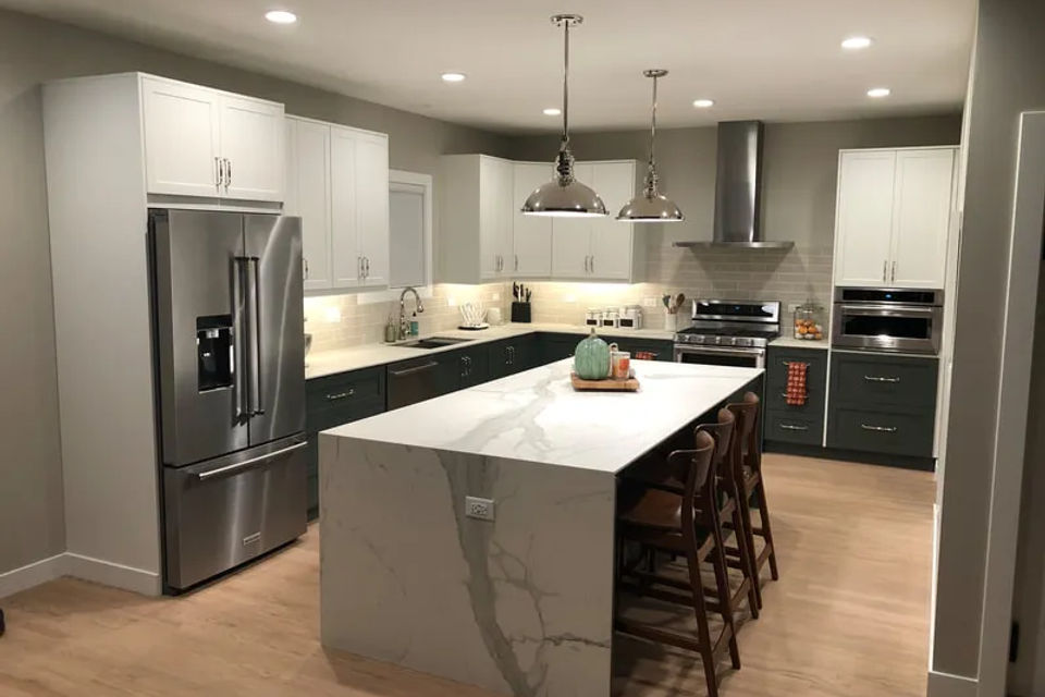 Complete kitchen remodel with white shaker cabinets and quartz countertops in Evanston IL