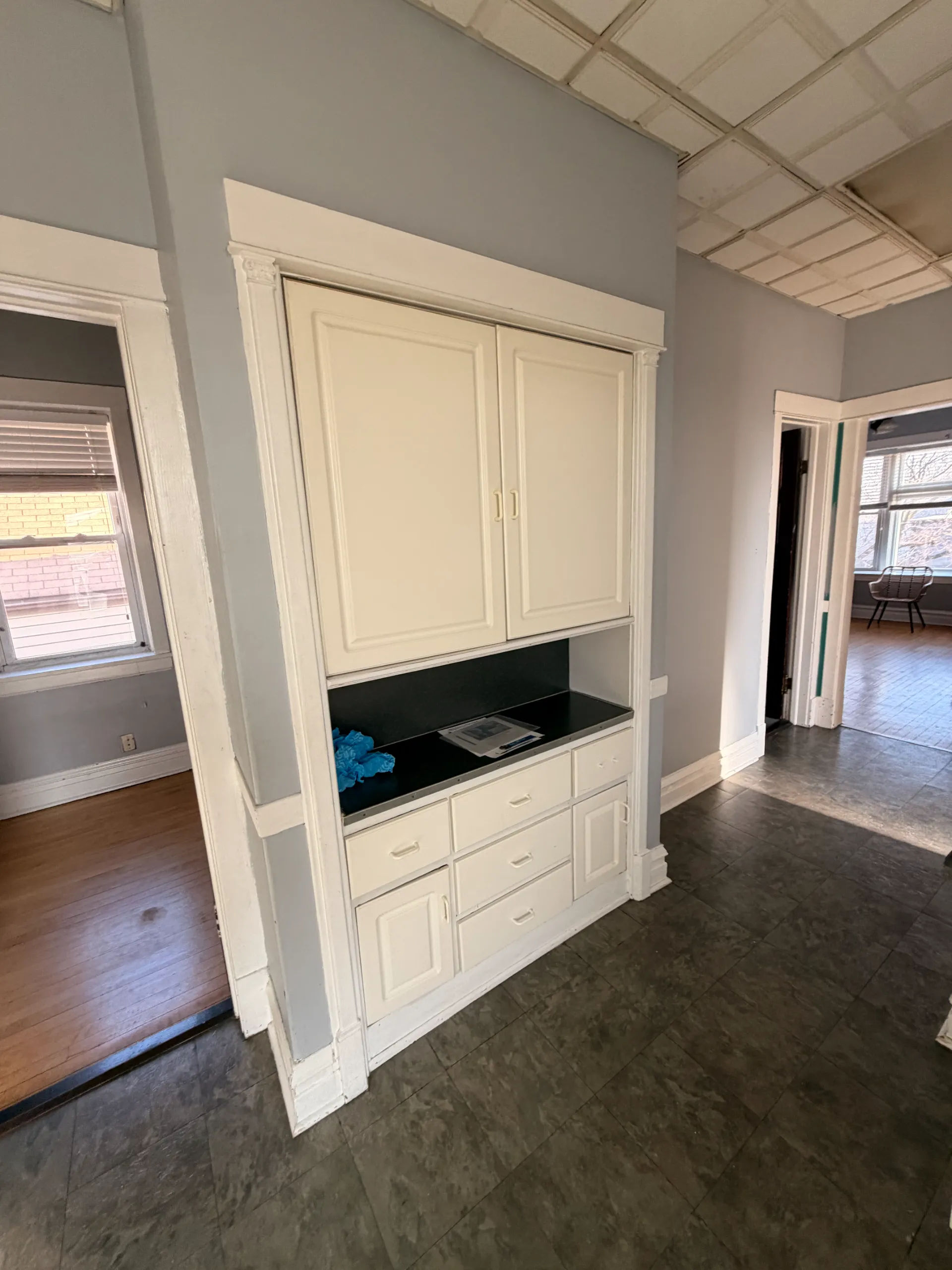 Before photo of original kitchen wall in Chicago three-flat showing dated finishes prior to Assembly Squad remodel
