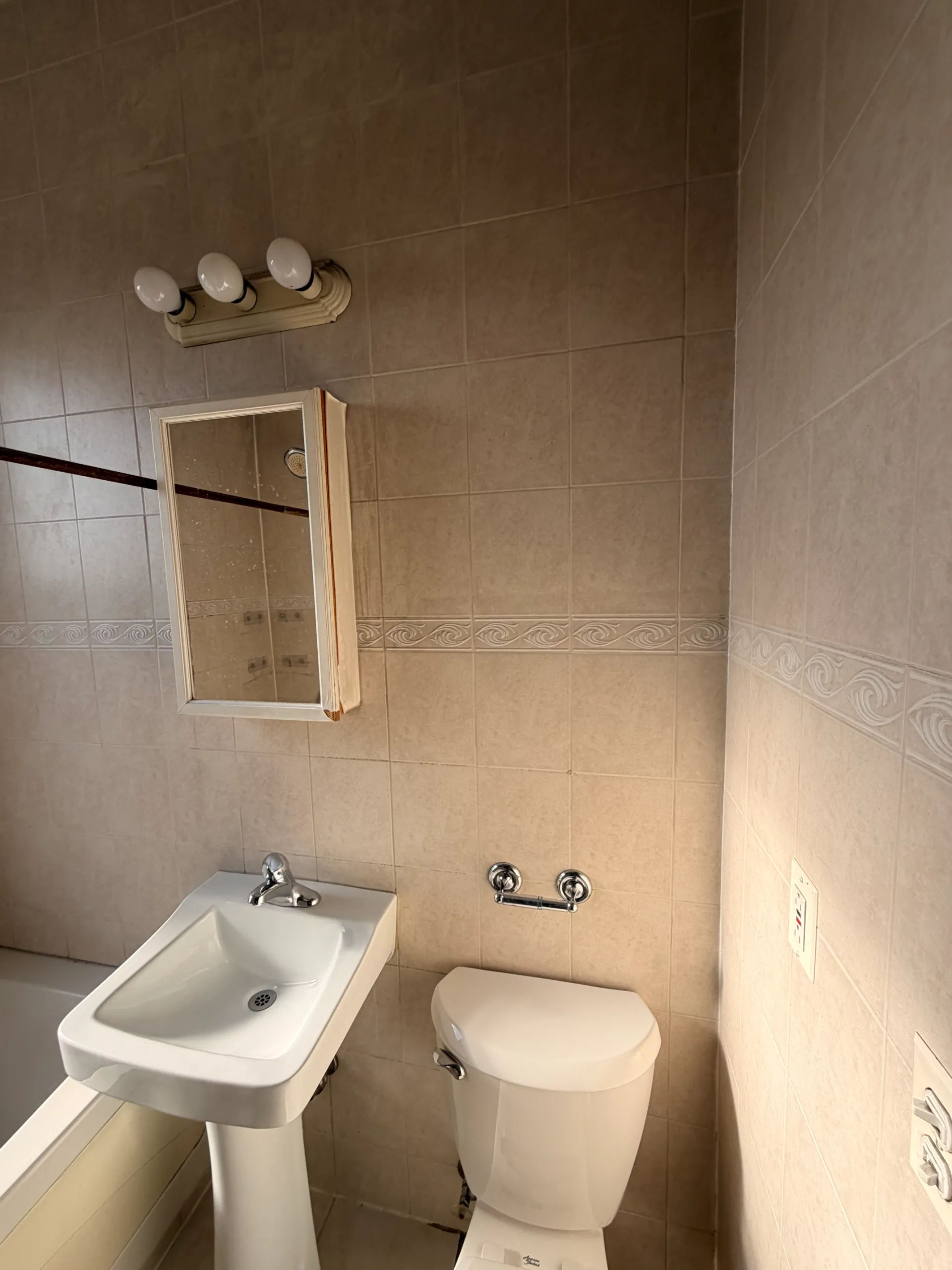 Before photo of unused room corner prior to laundry conversion in Chicago Logan Square three-flat by Assembly Squad