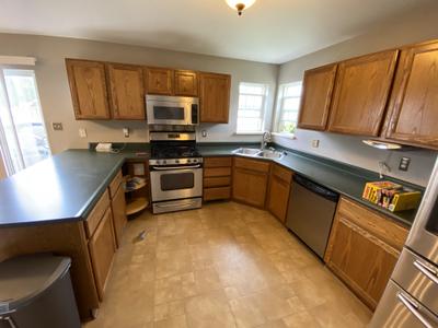 Logan Square kitchen before remodel -- 1980s dated cabinets original condition Chicago 60647