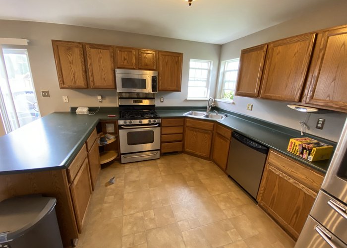 Logan Square kitchen before remodel -- original 1980s dated cabinets and design Chicago 60647