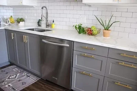 Complete West Loop condo kitchen renovation view -- two-tone cabinets custom built-in bar