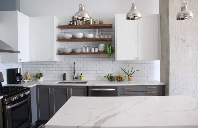 West Loop condo kitchen renovation with two-tone cabinets by Assembly Squad