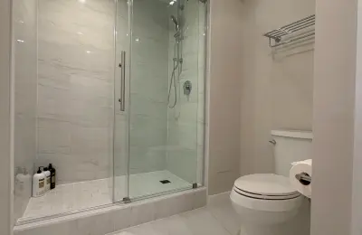 680 Lake Shore Drive Streeterville bathroom tub-to-shower conversion with custom concrete base