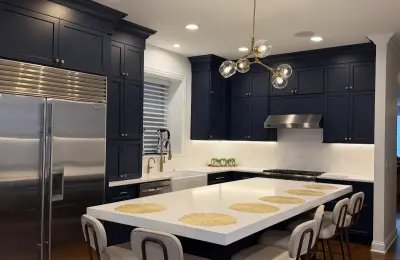 Wicker Park whole home remodel -- custom navy kitchen, master bath, entertainment built-ins at 1654 N Oakley Ave Chicago