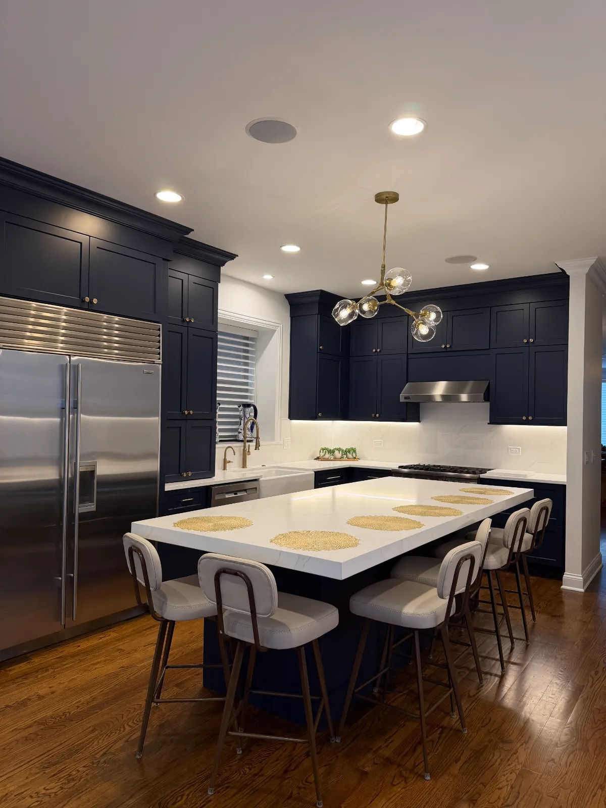 Wicker Park custom navy kitchen after renovation - modern island and quartz countertops