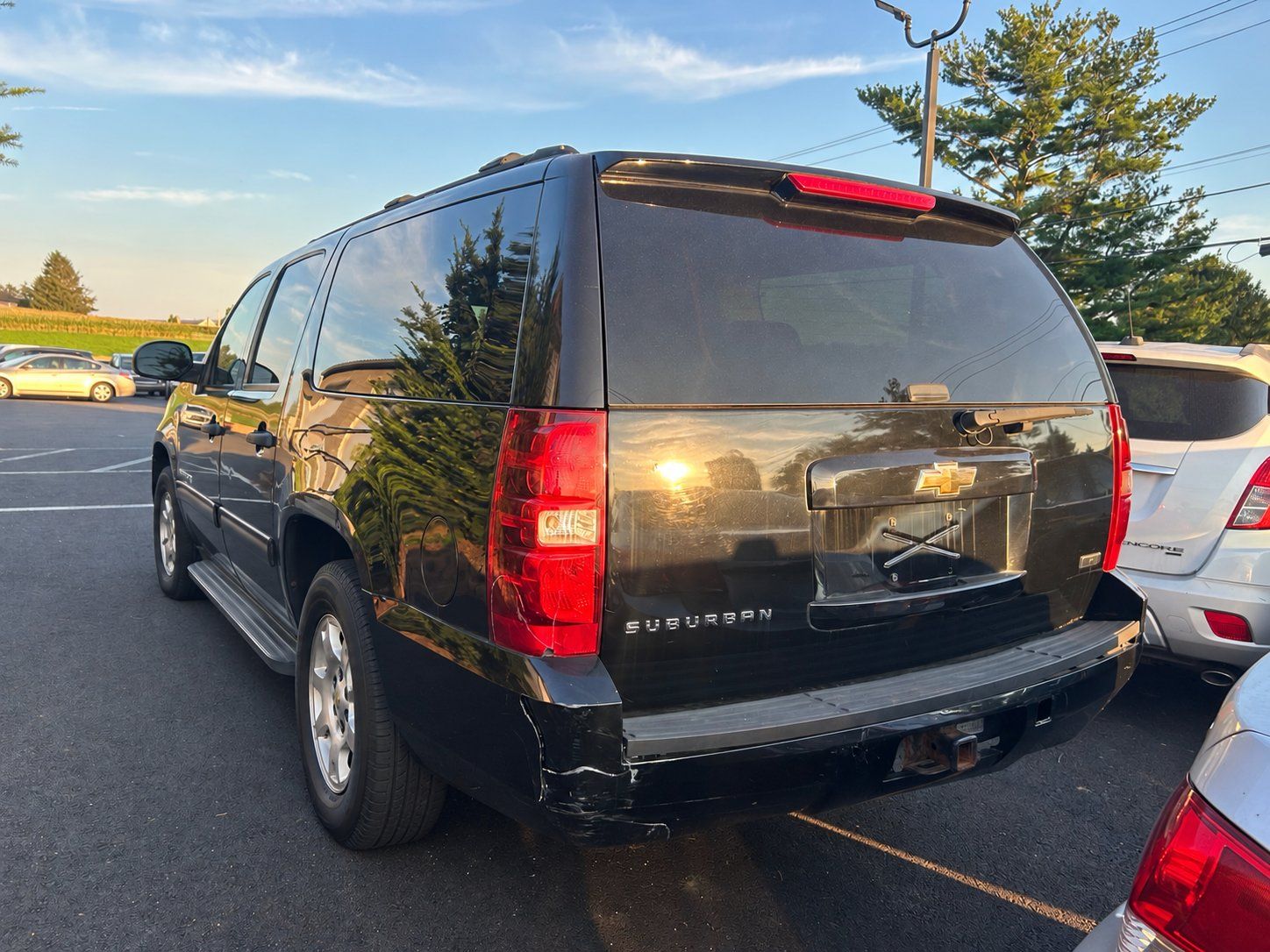 2010 Chevrolet Suburban rear three-quarter driver side