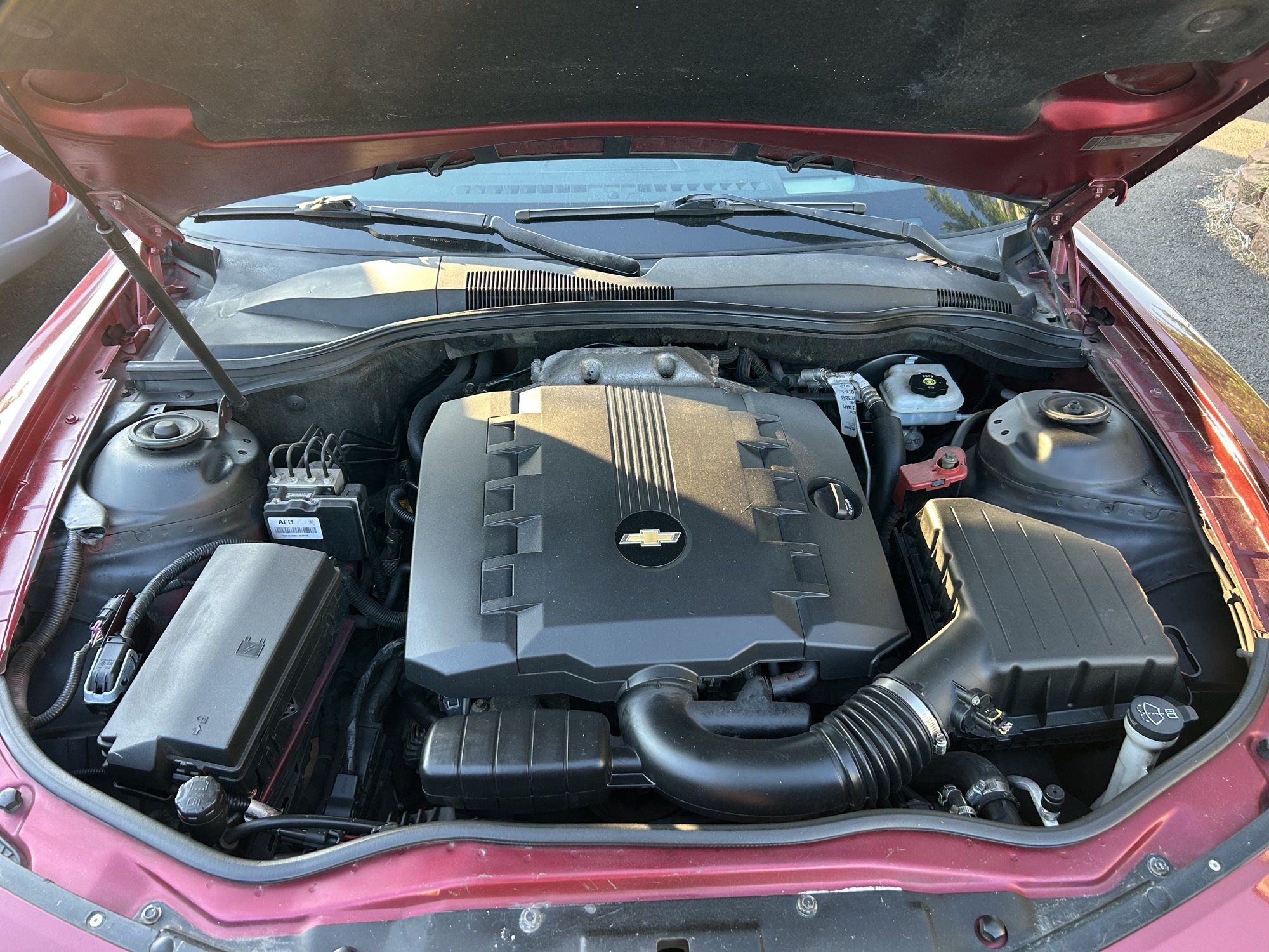 Red Chevrolet Camaro coupe 3.6L V6 engine