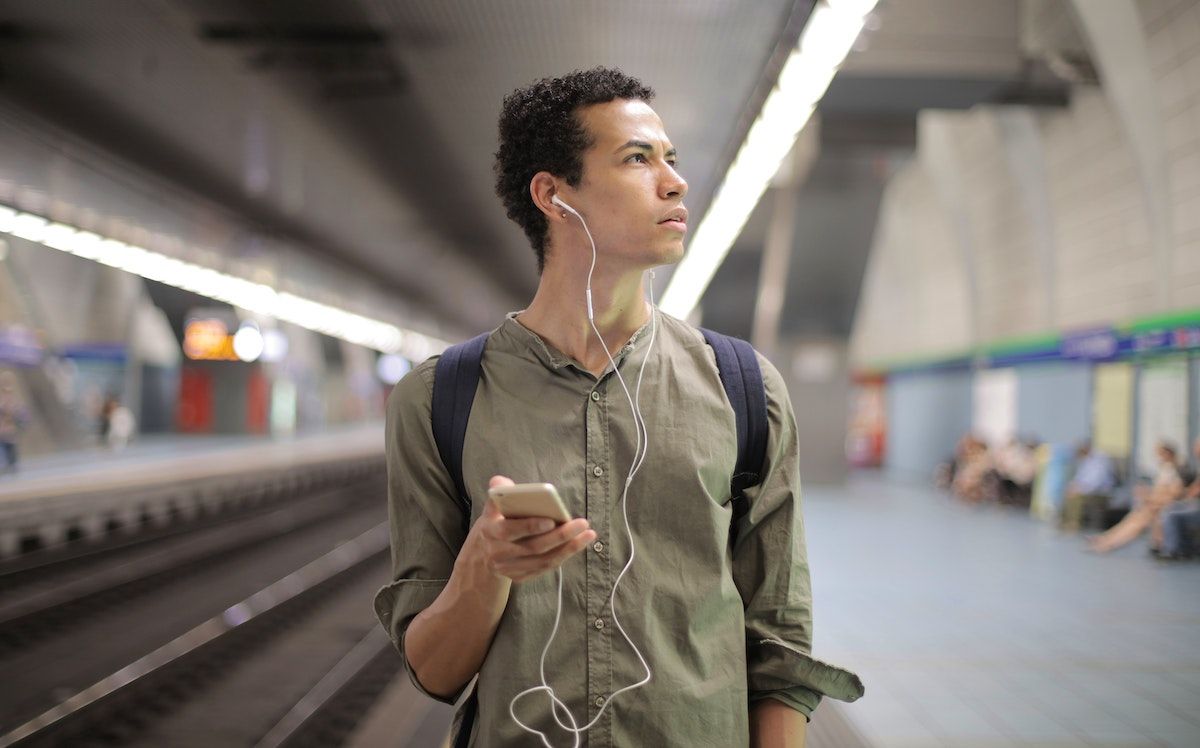 Man with phone wondering if he should get AirHelp Plus