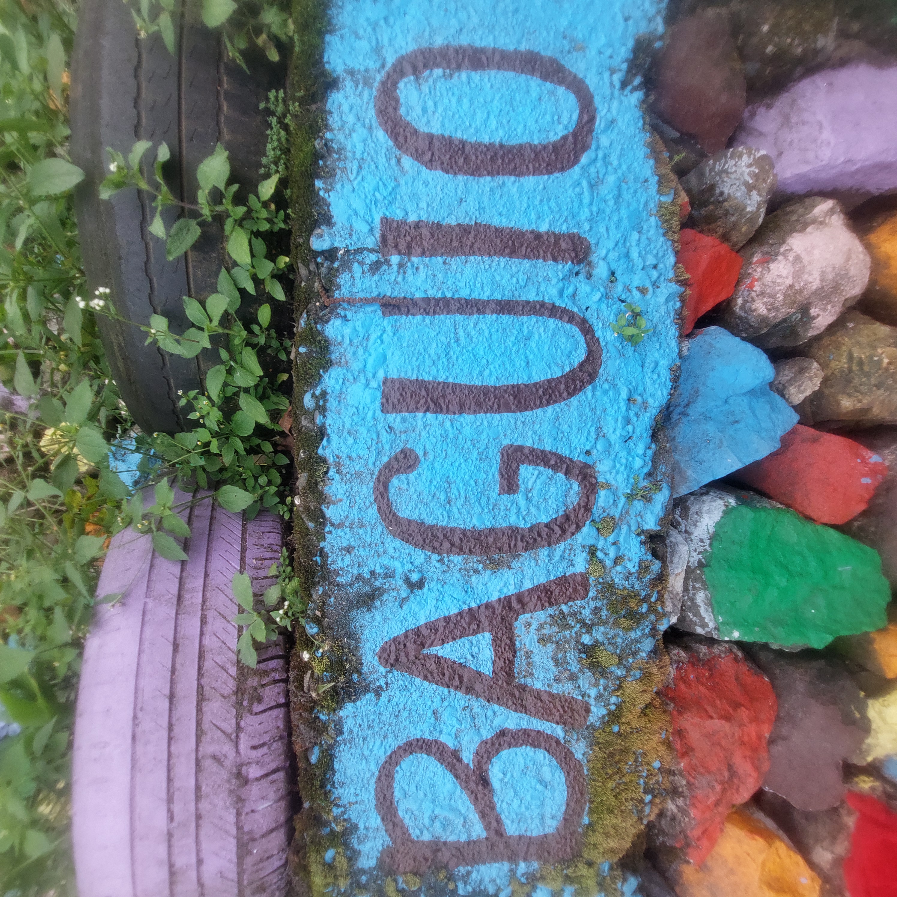 Painted rock walls with the word "Baguio".