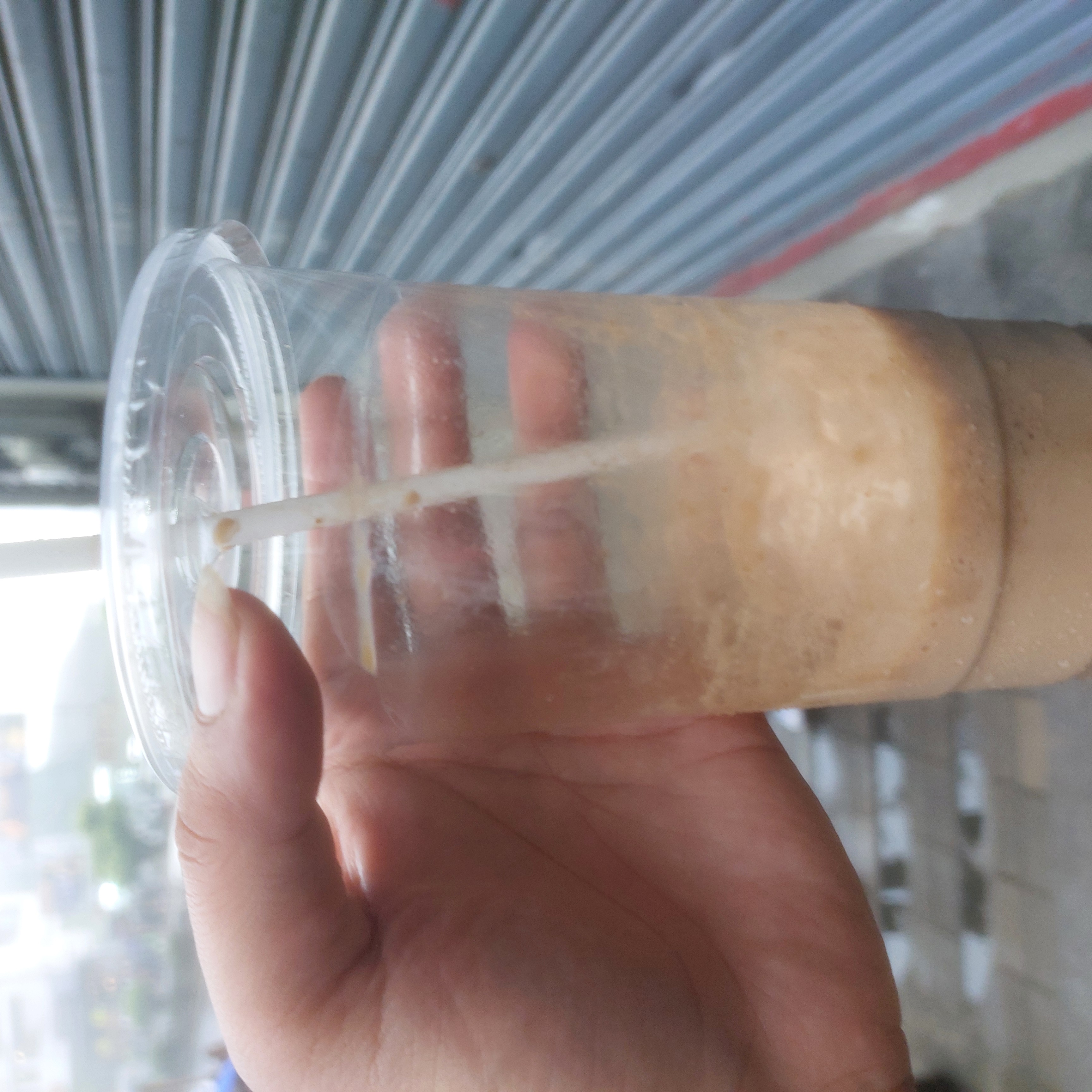 Half-finished cup of iced coffee.