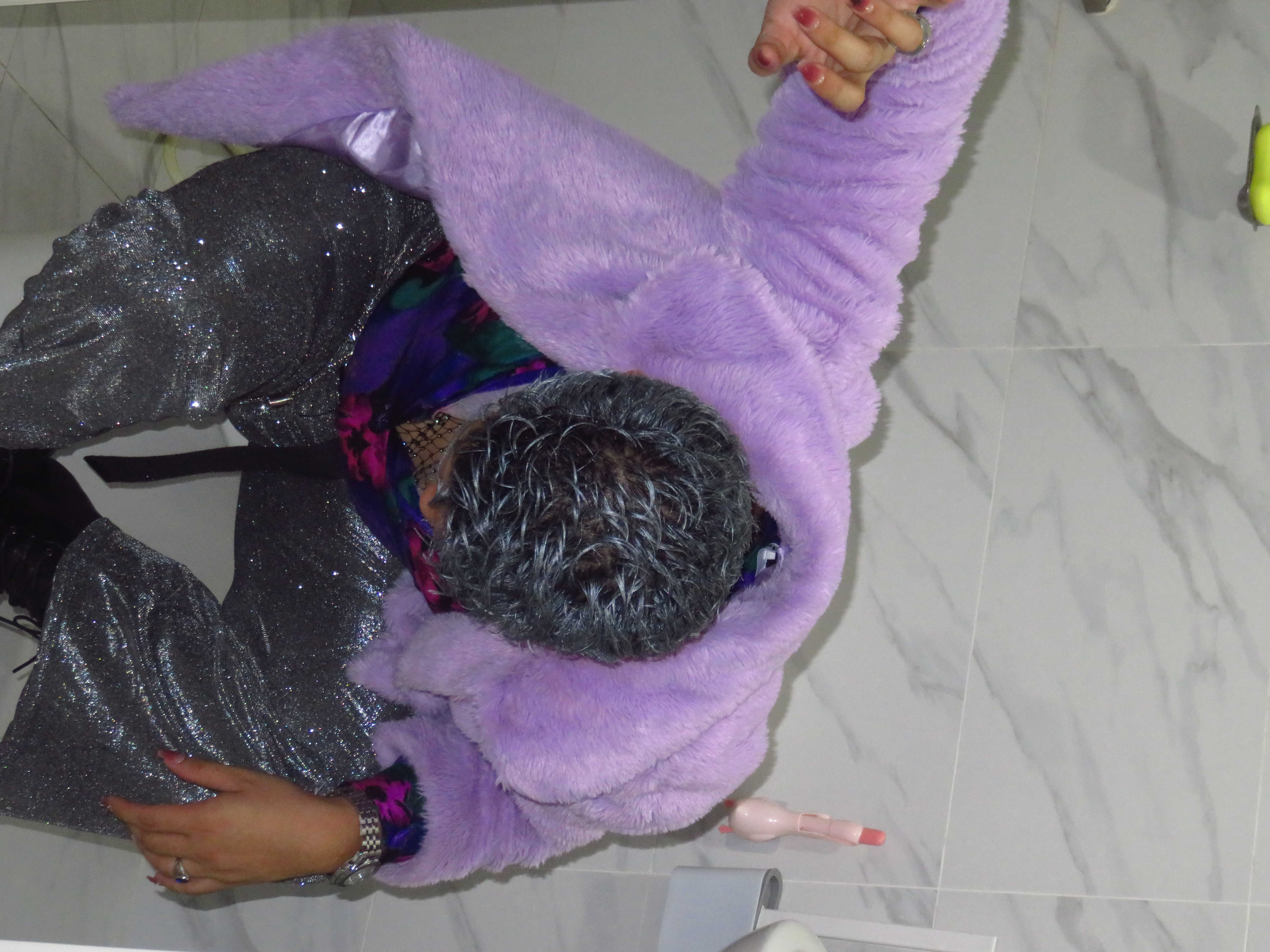 Nico stepping on a covered toilet bowl with his 8-inch heels.