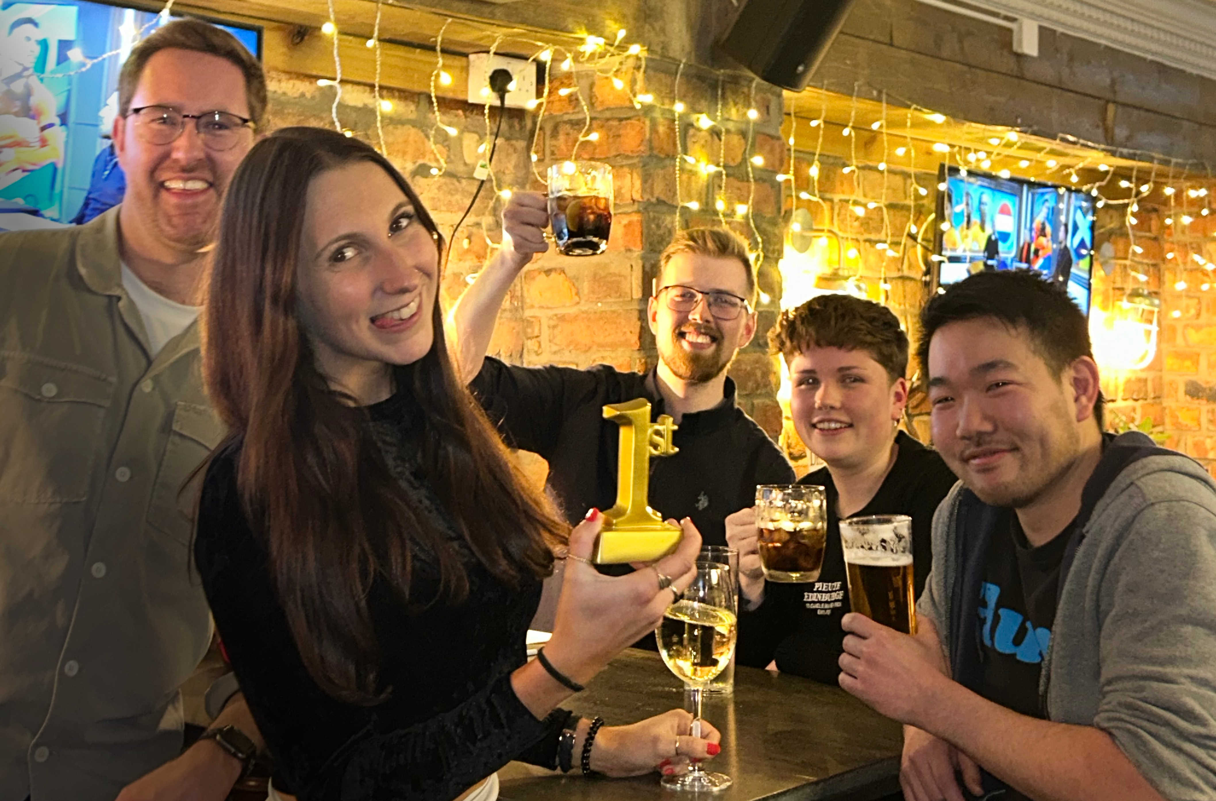 Team 8MS pose with drinks and a first place trophy.