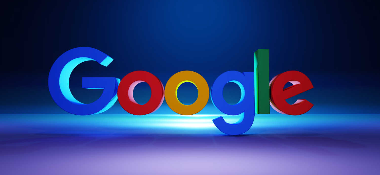 3D graphic of the Google logo against a blue background.