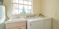 White Diswasher Beside Beautiful Peach Color Sink