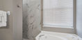 Marble Walls With Modern White Bath Tub