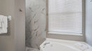 Marble Walls With Modern White Bath Tub