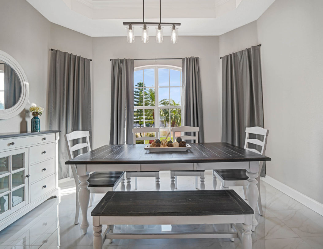 Balck abd White Wooden Dining Table With Beautiful Decoraton on Top