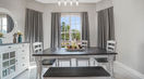 Balck abd White Wooden Dining Table With Beautiful Decoraton on Top