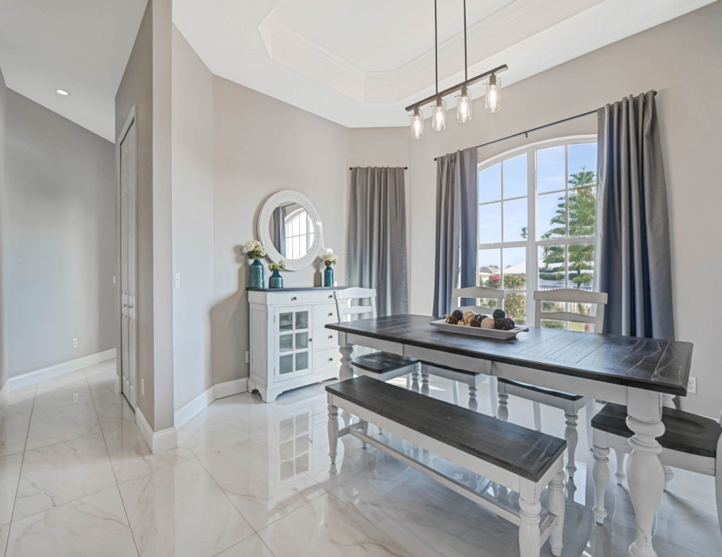 White and Clean Seven Seater Dining Area of Sunset Manor Vacation Home Port Charlotte