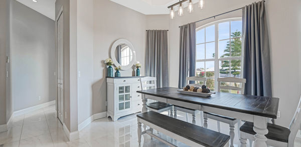 White and Clean Seven Seater Dining Area of Sunset Manor Vacation Home Port Charlotte