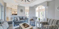 Wide Beautiful Living Room With Grey and Stripe Couch Set